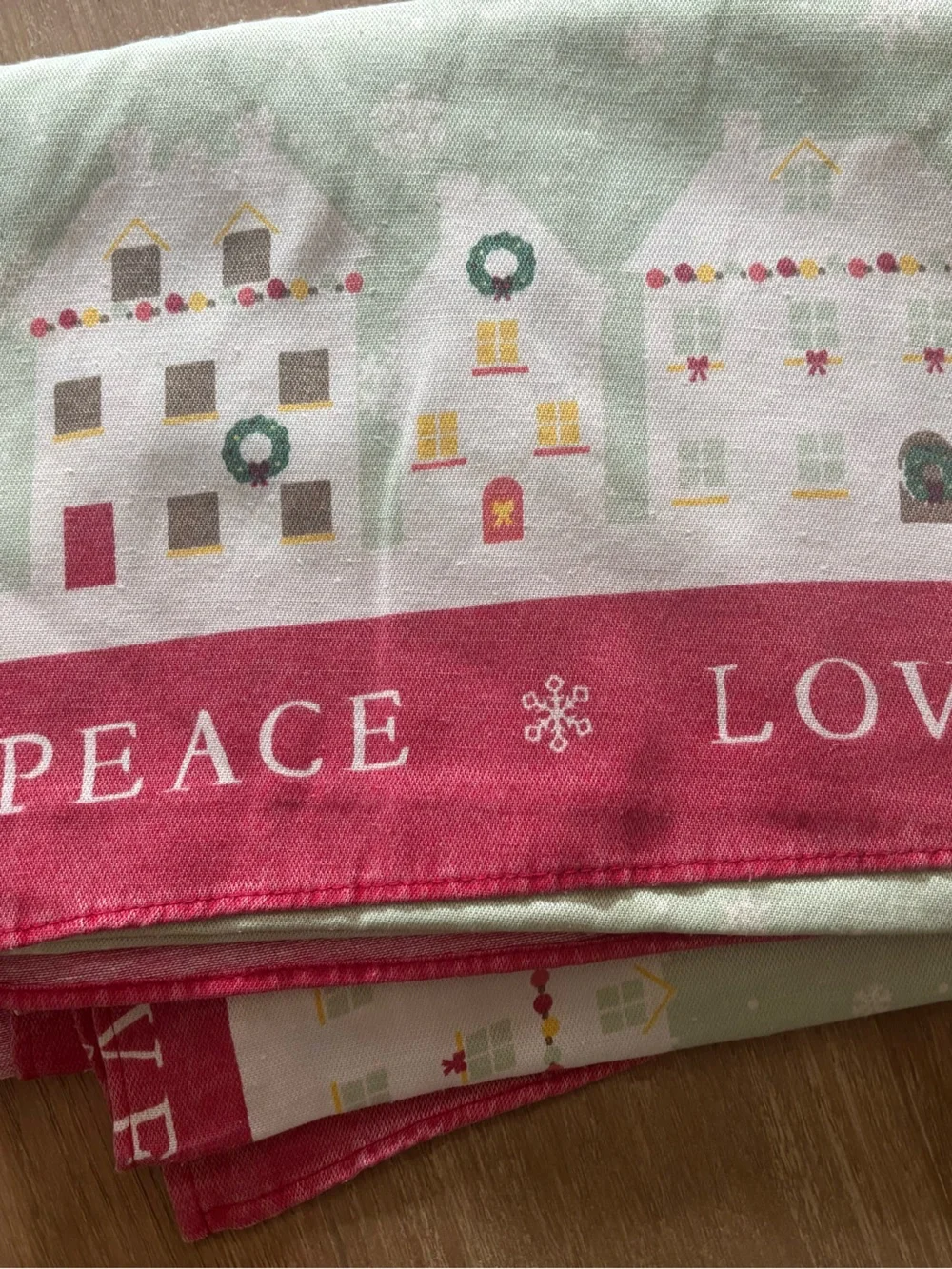 St. Nicholas Square Holiday Village Table cloth in Red, Green, White